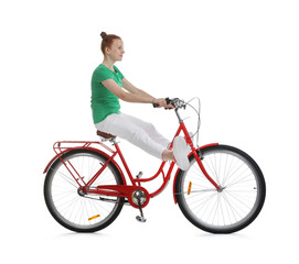 Teenage girl riding bicycle on white background