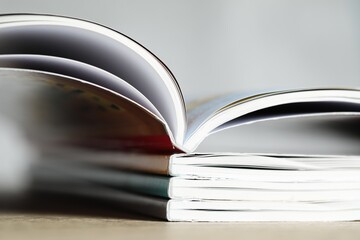 Stack of different magazines on table, closeup