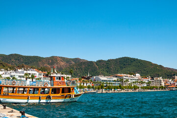 View of Marmaris city, with moored boats against the backdrop of mountains