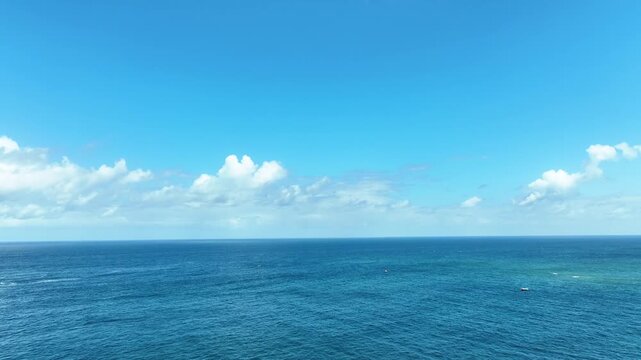 Open ocean with flat blue horizon and sky

