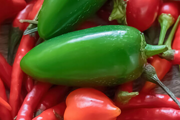 assorted hot chili and jalapeno close-up in a kanth basket