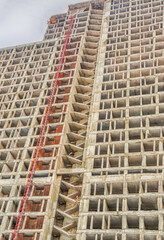 construction of apartments high cement base against the sky