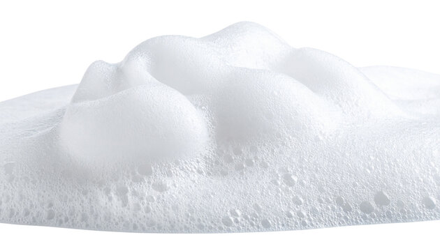 White foam with numerous small bubbles, creating a soft, airy, and frothy texture.