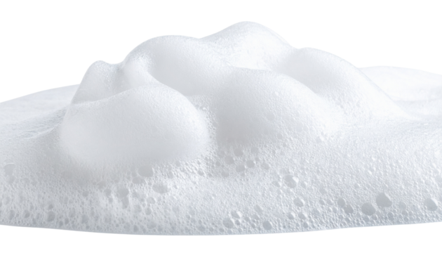 White foam with numerous small bubbles, creating a soft, airy, and frothy texture.