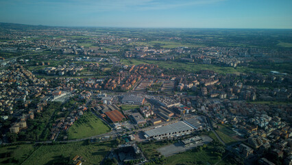 A park in the eastern part of Rome, a landscape that blends the greenery of the trees with the popular buildings.