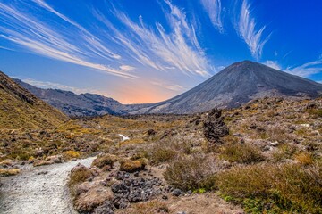 Hiker near rugged Ngauruhoe lava fields