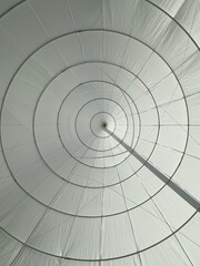 Naklejka premium Geometric Spiral Structure in White Fabric with Circular Lines
