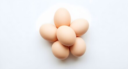 Freshly gathered eggs arranged neatly on a light background, showcasing their smooth surface and natural colors