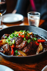 Plate of meat with vegetables and onions
