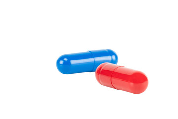 Red and blue pill representing a critical choice or dilemma. A medical and business metaphor for decision, strategy, and future alternatives isolated on white background with clipping path.
