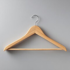 Light brown wooden hanger on gray background
