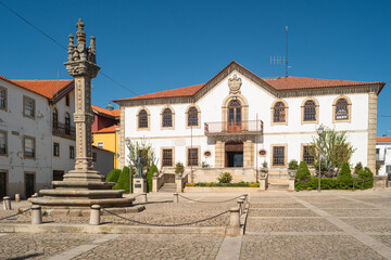 View of the sixteenth century gothic manueline style granite pillory and the city hall building of...