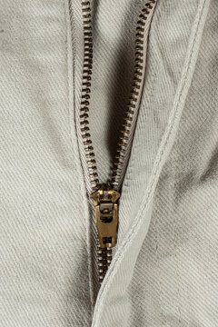 Macro Close-Up of Denim Zipper on Cotton Jeans