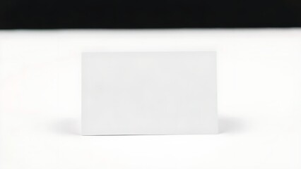 A minimalist business card design on a clean white background, showcasing simplicity and professionalism.