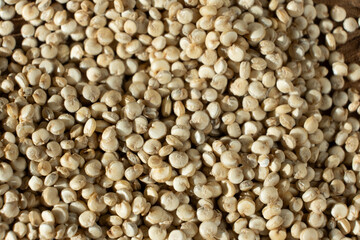 Top View of Dry White Quinoa Seeds. Natural Organic Surface.
