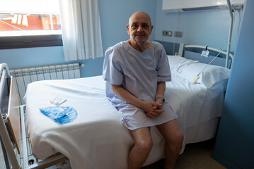 Elderly Man Sitting on Hospital Bed in a Medical Room Setting
