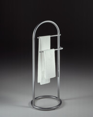 Still life of a steel towel rack, on a neutral background