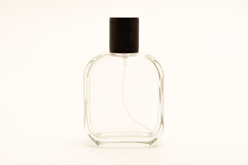 Empty glass perfume bottle. Elegant transparent flacon once filled with fragrance, now standing...