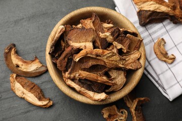 Dried chanterelle mushrooms on wooden table, flat lay