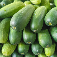 Stack of Fresh Cucumbers in Traditional Market