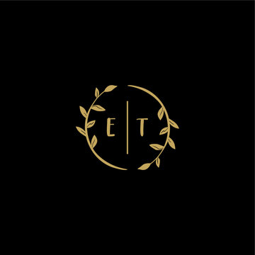ET feminine and elegant wedding monogram initial logo with circle floral gold