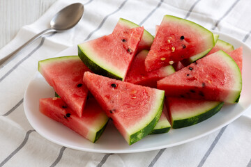 Raw Organic Watermelon Slices on a Plate, side view. Close-up.