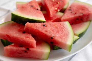 Raw Organic Watermelon Slices on a Plate, side view. Close-up.