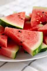 Raw Organic Watermelon Slices on a Plate, side view. Close-up.