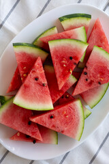 Raw Organic Watermelon Slices on a Plate, top view. Flat lay, overhead, from above.