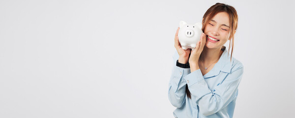Portrait Smiling excited woman happy hugging piggy bank saving money with piggy dream goal,...