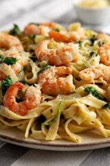 Homemade Creamy One-Pot Spinach Shrimp Pasta on a Plate, side view.