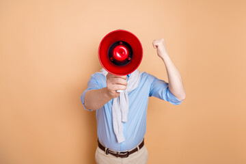 Man with a bright red megaphone gesturing confidently against beige background, showcasing...