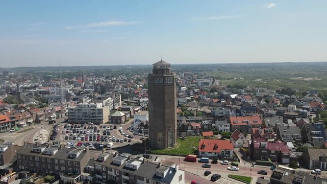 Aerial view of the iconic Zandvoort watertower amidst a cityscape with buildings, streets, and the beach in the distance, Zandvoort, North Holland, Netherlands.