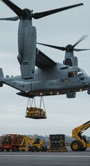 Obraz premium Military tiltrotor transport aircraft lifting cargo