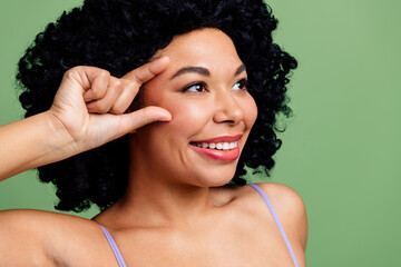 Confident young woman with natural beauty, showing positivity and self-assurance against a vibrant...