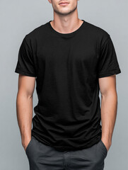 Fototapeta premium A beautiful male model wearing a black t-shirt. A product shot for fashion and apparel. best use for mockup.