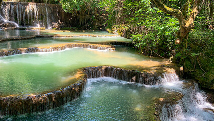  Most magnificent and breathtaking nature of Kuang Si waterfall and cascade and its green, emerald crystal clear water and lake in Luang Prabang 