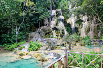 Most magnificent and breathtaking nature of Kuang Si waterfall and cascade and its green, emerald crystal clear water and lake in Luang Prabang 