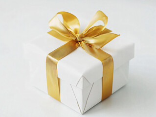 Obraz premium Elegant White Gift Box with Golden Ribbon on Light Background