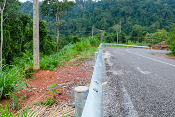 Sharp curb, mountainous road in Laos 