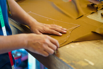The process of measuring materials to be sewn into clothing