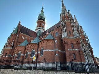 Dramatic closeup of large church with blue sky in Krakow, Poland