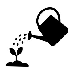 Obraz premium Watering Can Nurturing Seedling with Water Drops for Growth and Germination