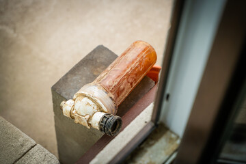 Close-up of an old used water filter flask