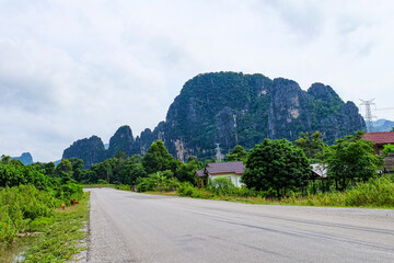 Beautiful green nature, trees in the water and mountain in the south of Laos, Khammuane province 