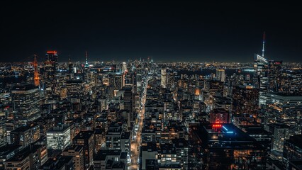 Photo of city skyline at night with illuminated buildings