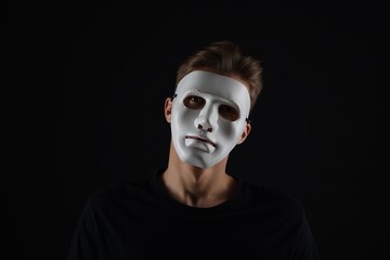 Anonymity. Man wearing mask on dark background