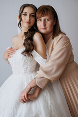 Mom and daughter share a special moment before the wedding ceremony