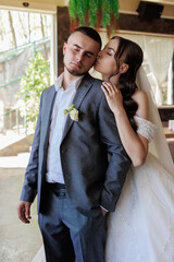 Couple shares a tender moment at their wedding reception in a charming indoor venue
