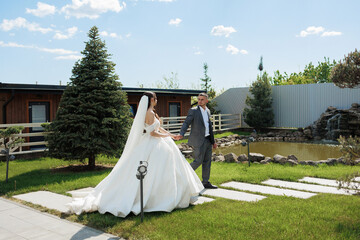 Romantic outdoor wedding celebration in a garden setting with a couple in formal attire
